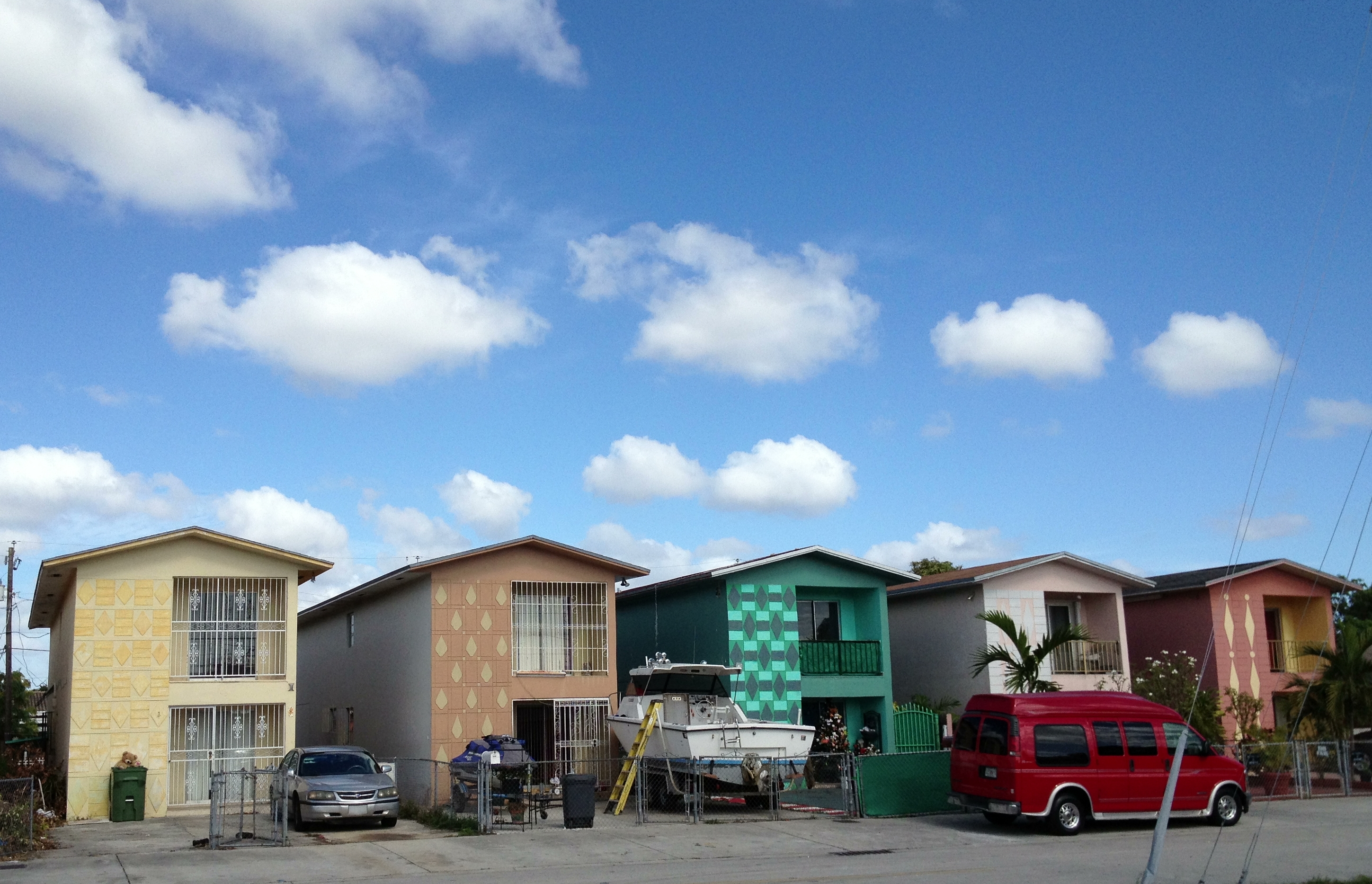 Hialeah neighborhood street with palm trees