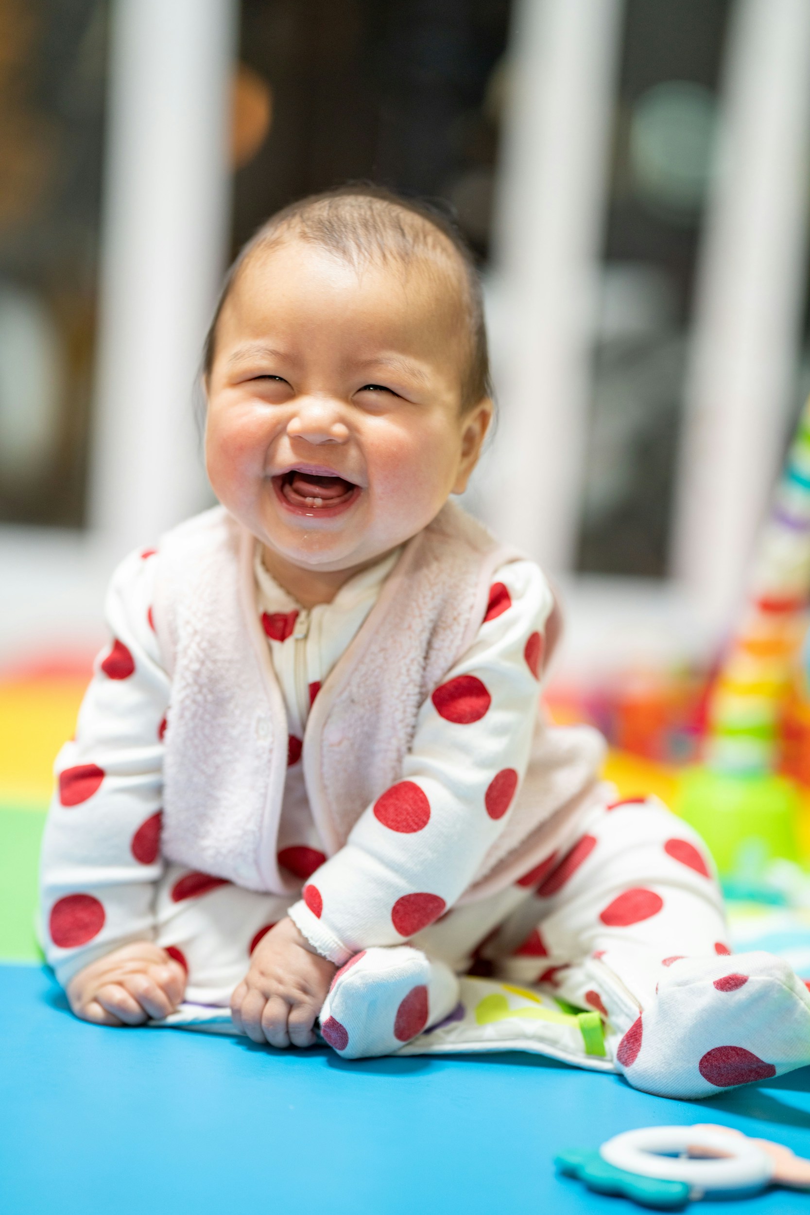 Young child playing on the floor while receiving at-home respiratory therapy