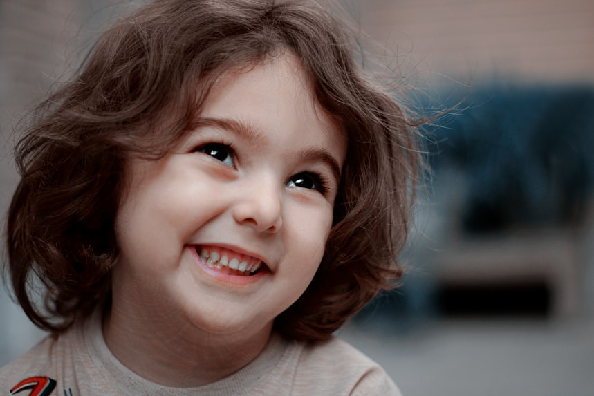 Pediatric patient laughing during a home respiratory therapy visit